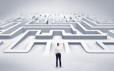 Businessman starting a flat 3d labyrinth
