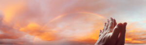 Prayer hands in sky