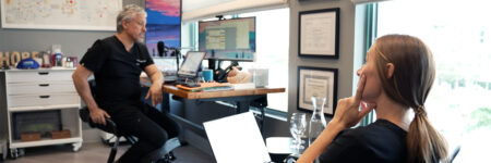 Dr. Tanio and Tresa talking in the office