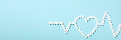 white dotted heart monitor line with an outline of a heart in the middle