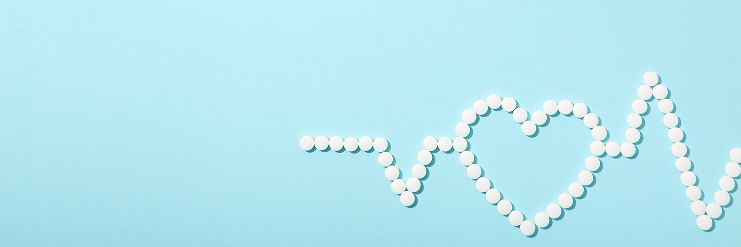 white dotted heart monitor line with an outline of a heart in the middle