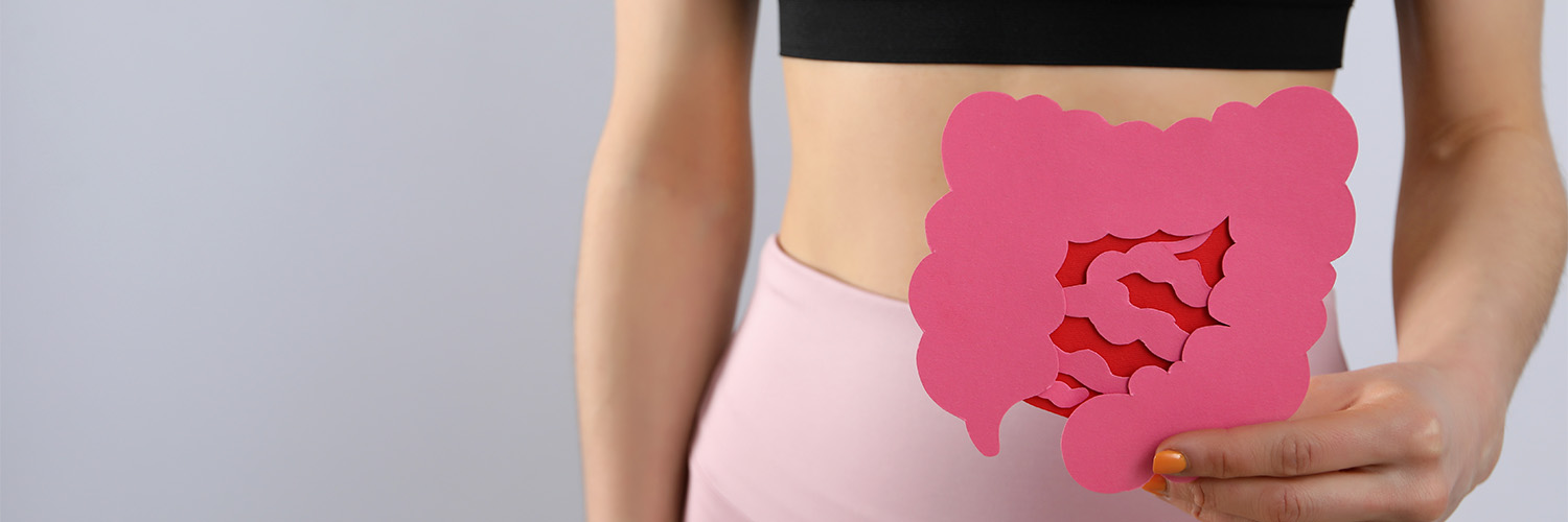 female holding stomach, gut paper cut out