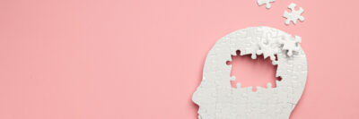 Brain Puzzle Silhouette on Pink Background