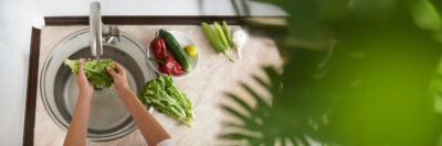 fresh produce being washed in the sink