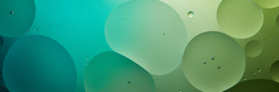abstract background from mixed water and oil in turquoise and green