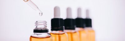 Droppers lined up against a white background