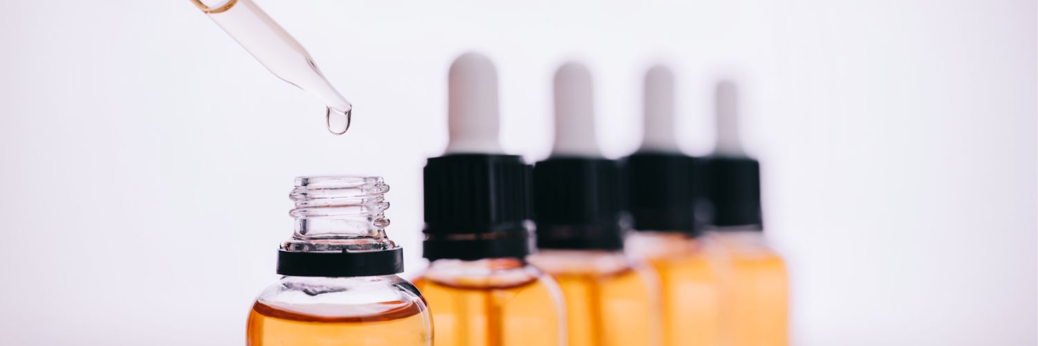 Droppers lined up against a white background
