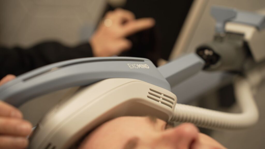 Close up of the Exomind TMS device on a patient
